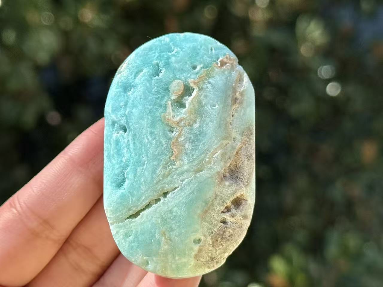 Natural Hemimorphite palm stone.